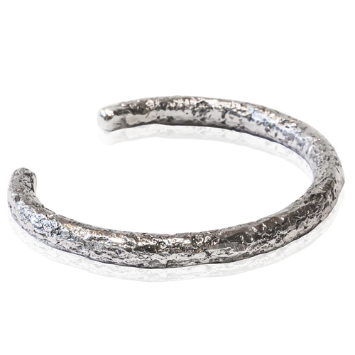 To keep busy during the lockdown period imposed in Mauritius, Forbes created the Forged by the Ocean bangle using natural basalt rock to shape the piece.