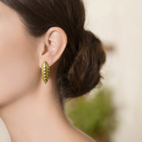 Model Wearing Pangolin Haka Earrings in 18ct Gold