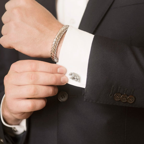 Mode Wearing Papa Bear Cufflinks in Sterling Silver and Pangolin Armour Bangle in Sterling Silver