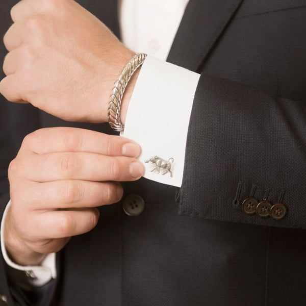 Model Wearing Warthog Cufflinks in Sterling Silver and Pangolin Armour Bangle in Sterling Silver